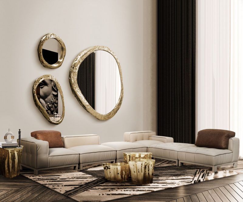 set of three coffee tables, nude sofa, and three round mirrors with gold frame