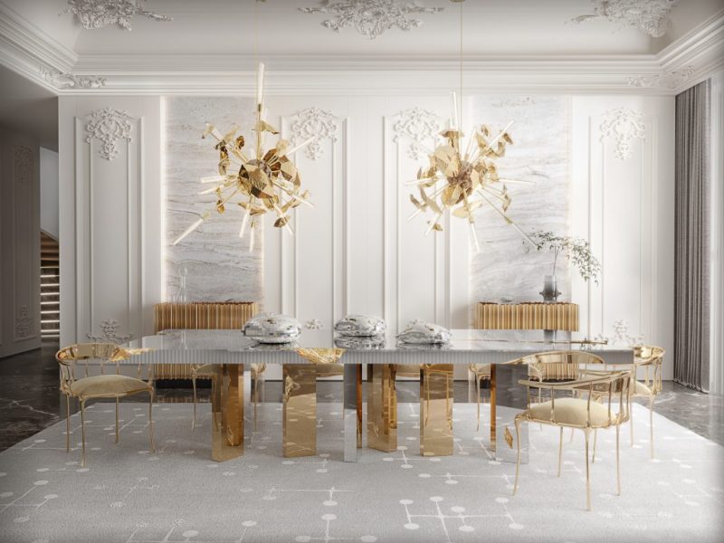 dining room with dining table in silver and gold and two suspenion lamps in gold