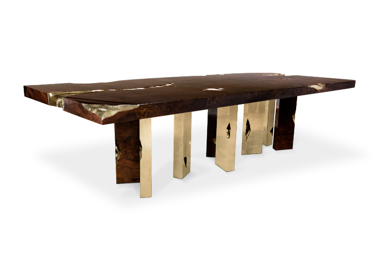 Modern dining table in wood with golden details 