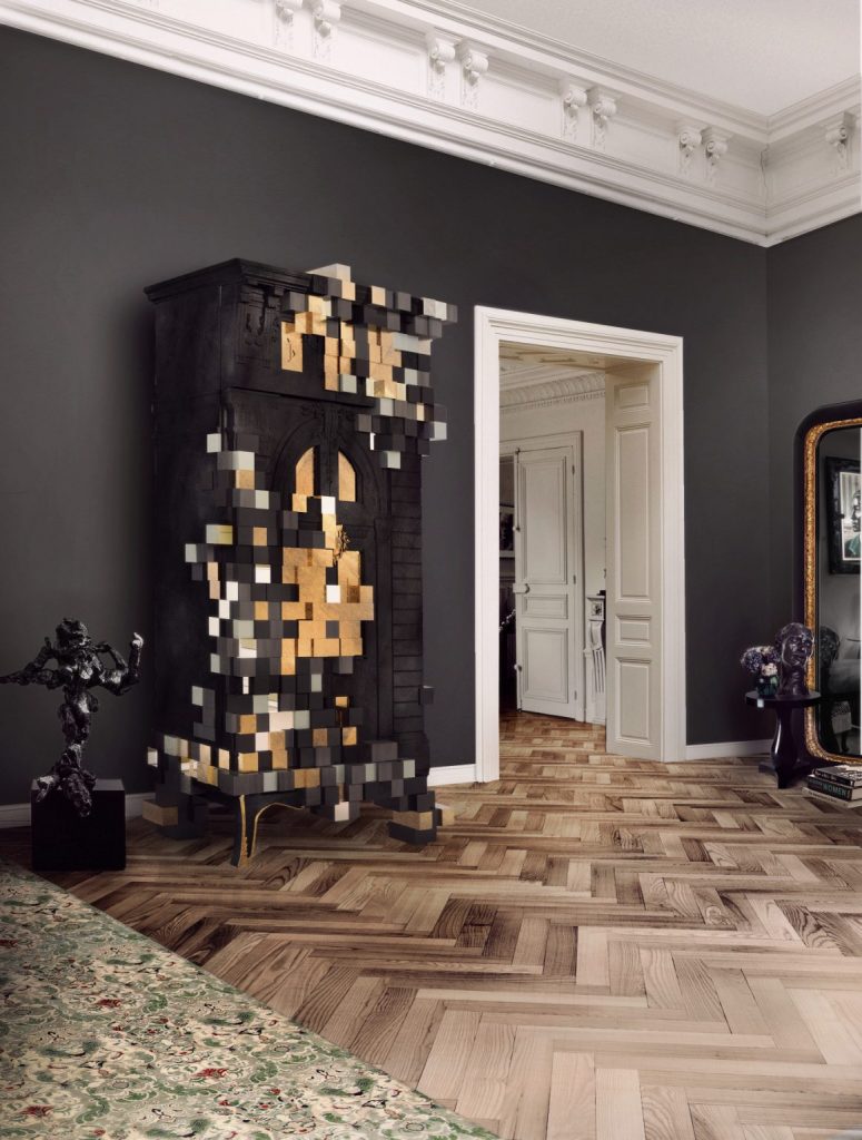  maximalism- an entrance with gray walls, a dark yellow cabinet, a black statue, white doors, and a rug.