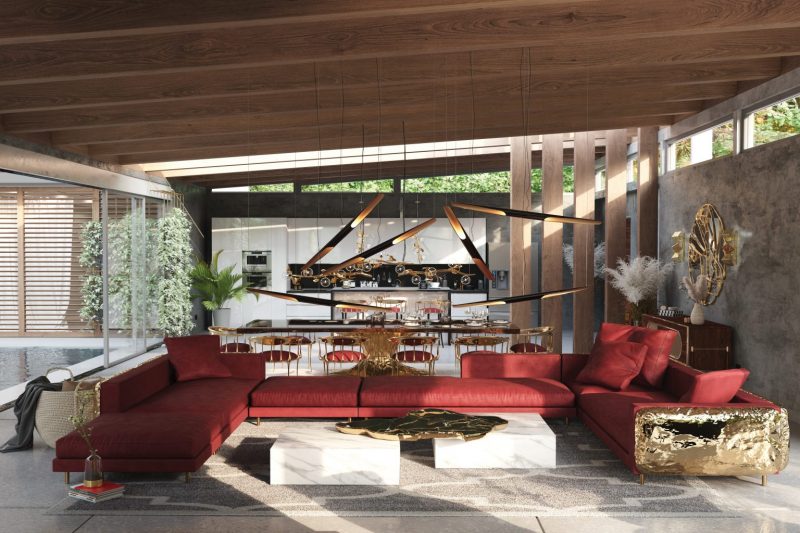 Los Angeles- contemporany living room with red ang gold sofa, center table with black and golden details, plants, mirror with gold details  