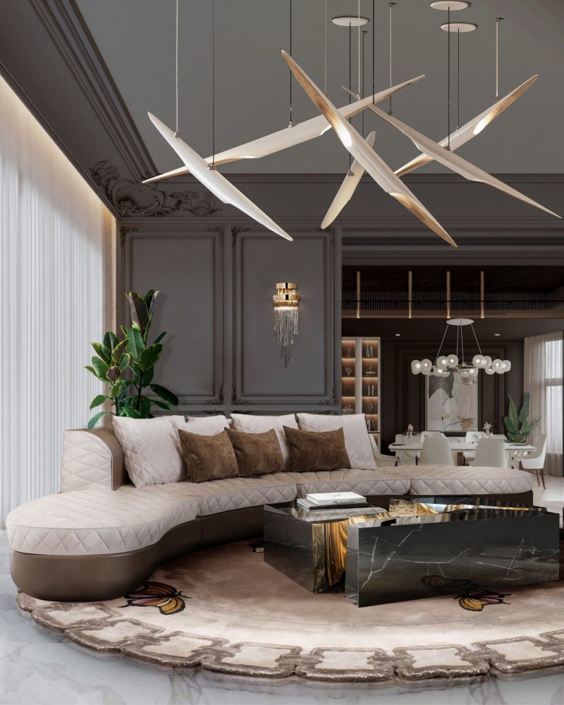 black center table with gold interior, brown soga with velvet cushions and beige carpet with butterflies