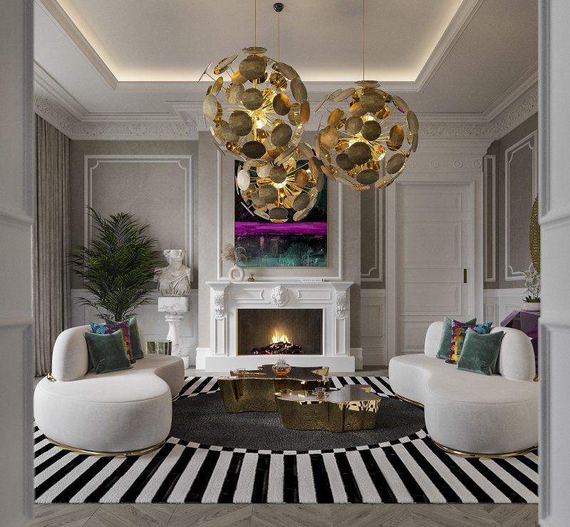 living room with two nude sofas with gold details, a white firplace, three stetmnet round suspension lamp, a side and center table in gold