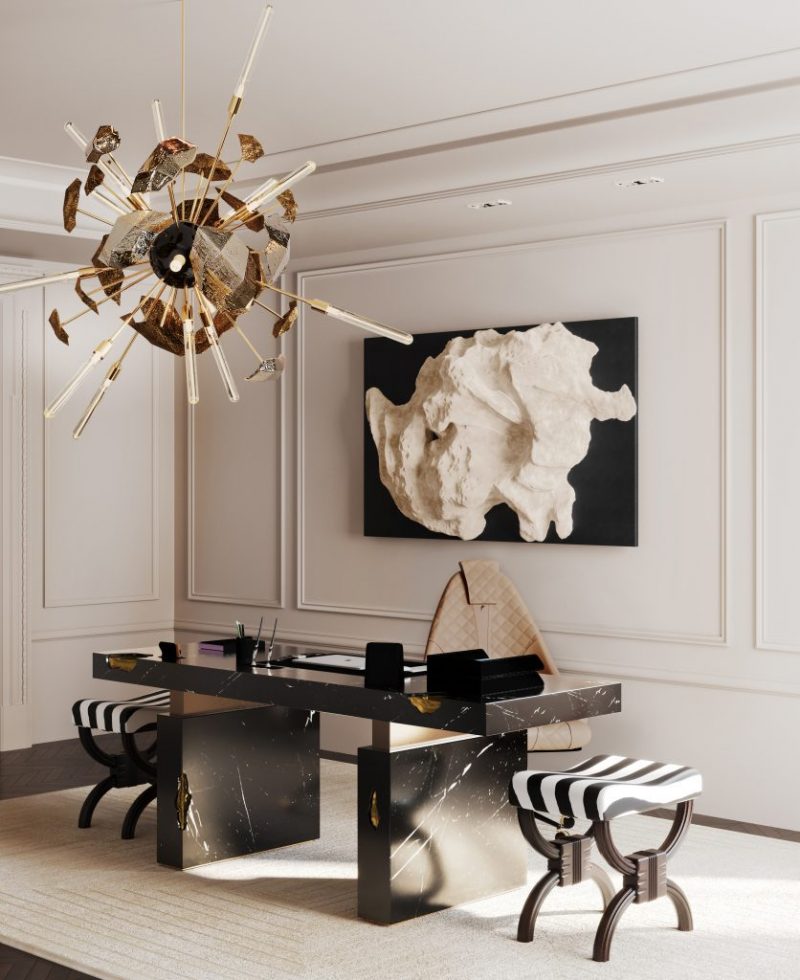 home office with dark marble desk, bege office chair and gold suspension lamp