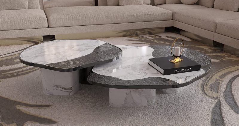 Ophelia Center Table - marble and black center table, a book, a rug and a cream and gold sofa 