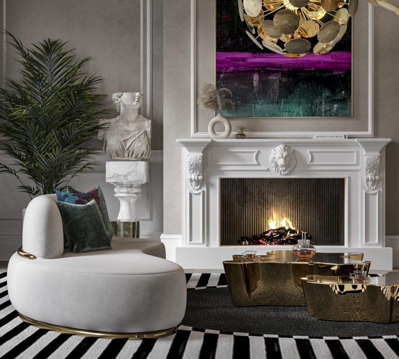 nude sofa with gold details, a gold coffee table, a white fireplace and a marble pedestal with a statue 